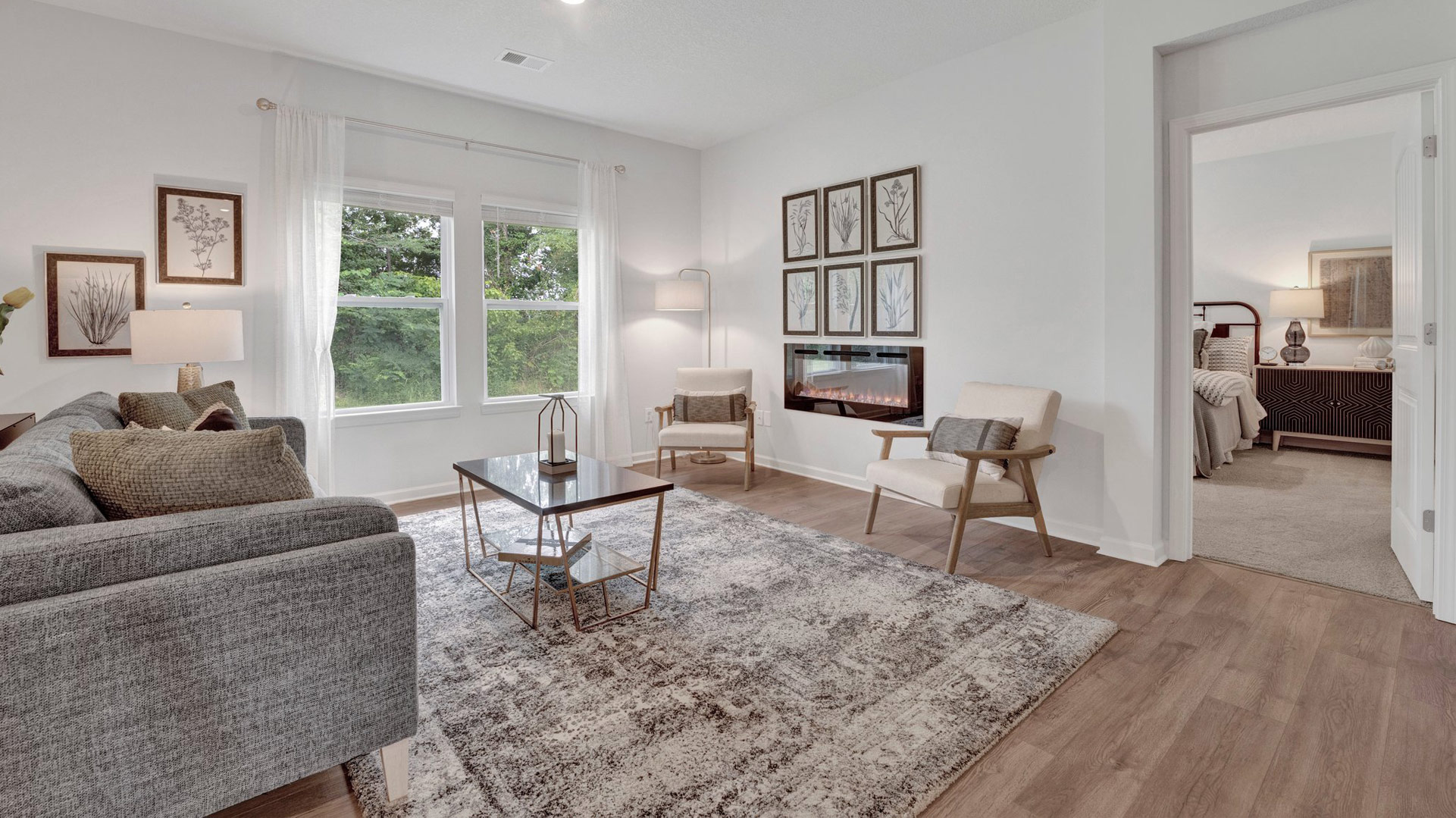 Living room with close access to primary bedroom