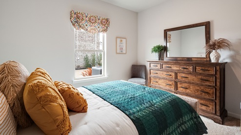 cali plan model in twin lakes community fourth bedroom with carpet flooring and 9 foot ceilings