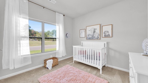 Second bedroom at the front of the home with a double window overlooking front yard