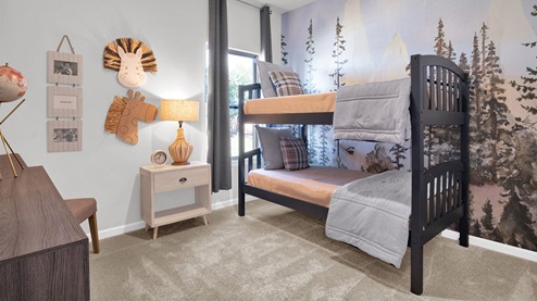 Third bedroom with neutral walls and carpet flooring