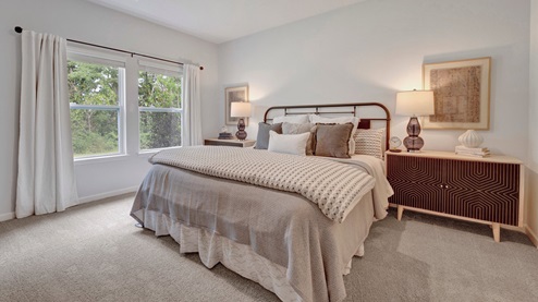 riverwood gardens new home community in oakland tennessee cameron plan primary bedroom overlooking the backyard