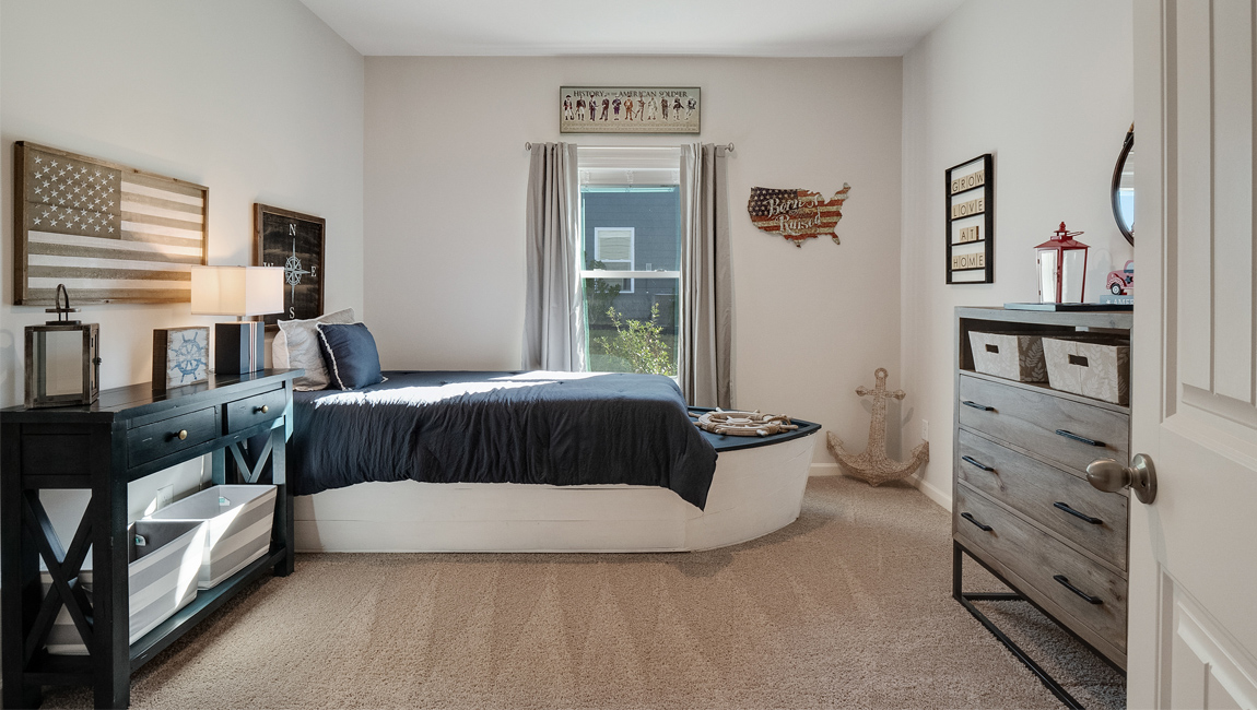 Third bedroom with a tall window for natural light