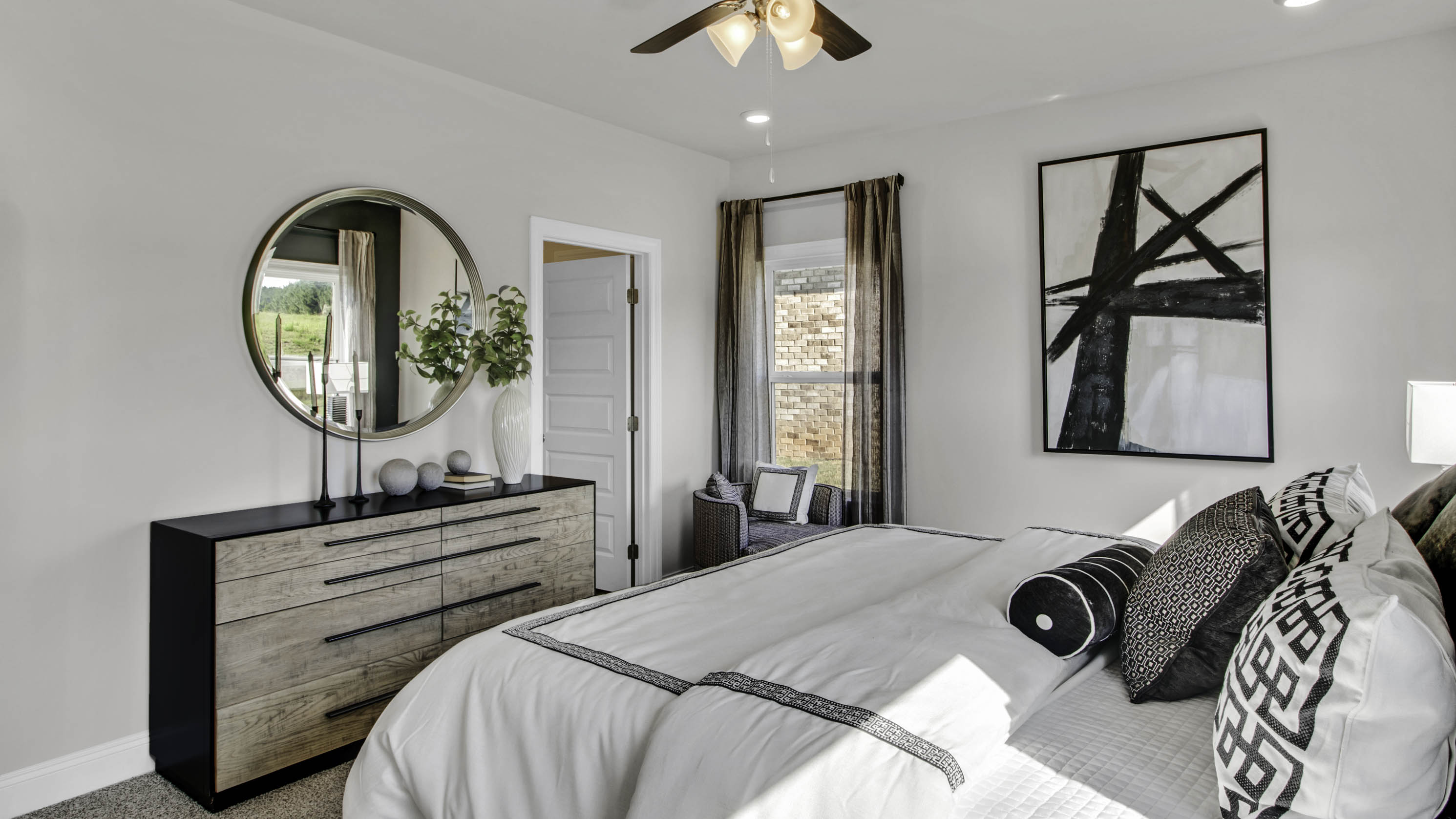 Spacious primary comfortably fitting a king size bed