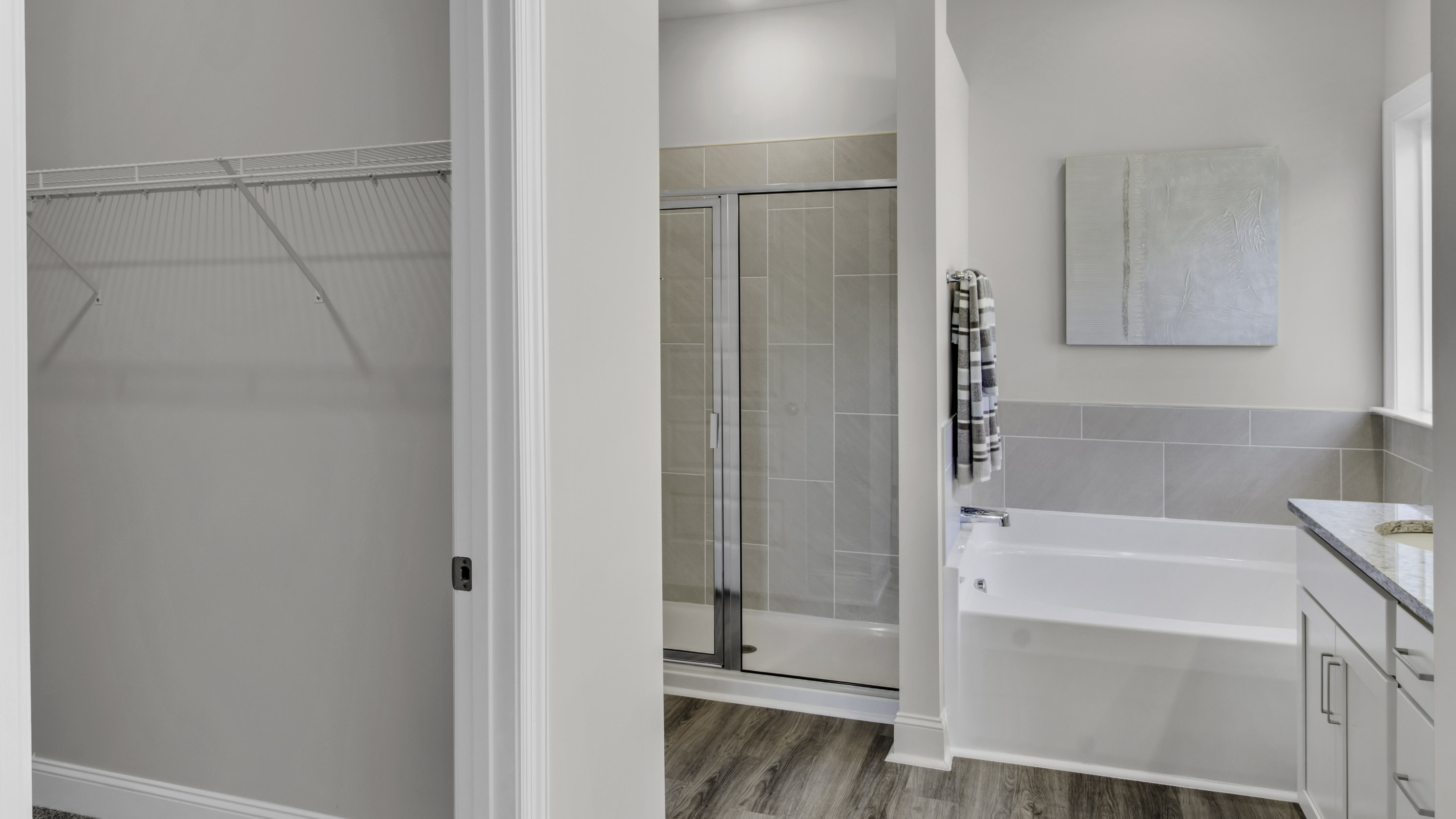 En suite with a tub insert and a walk in shower