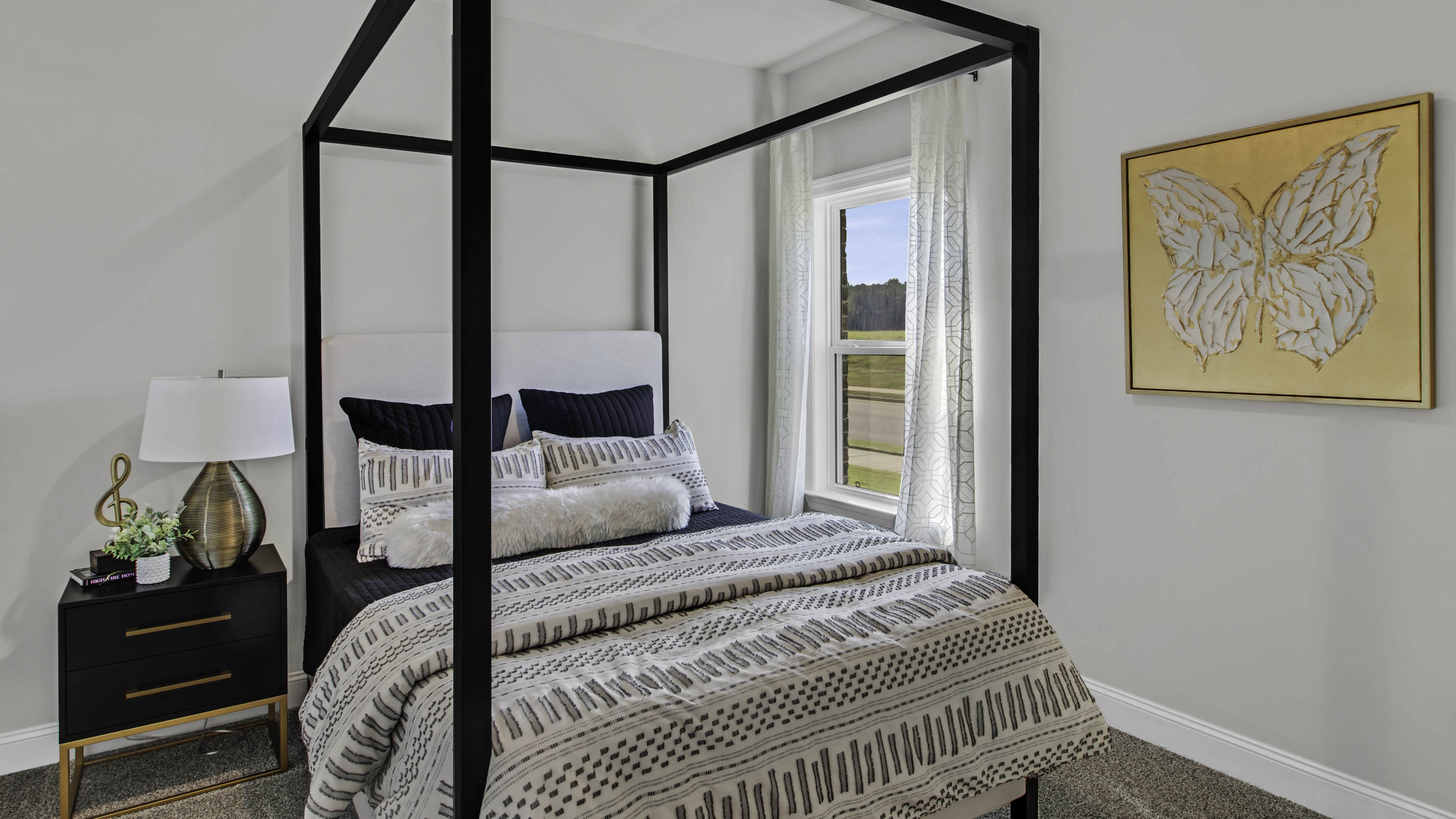 Third bedroom with carpet flooring and neutral paint