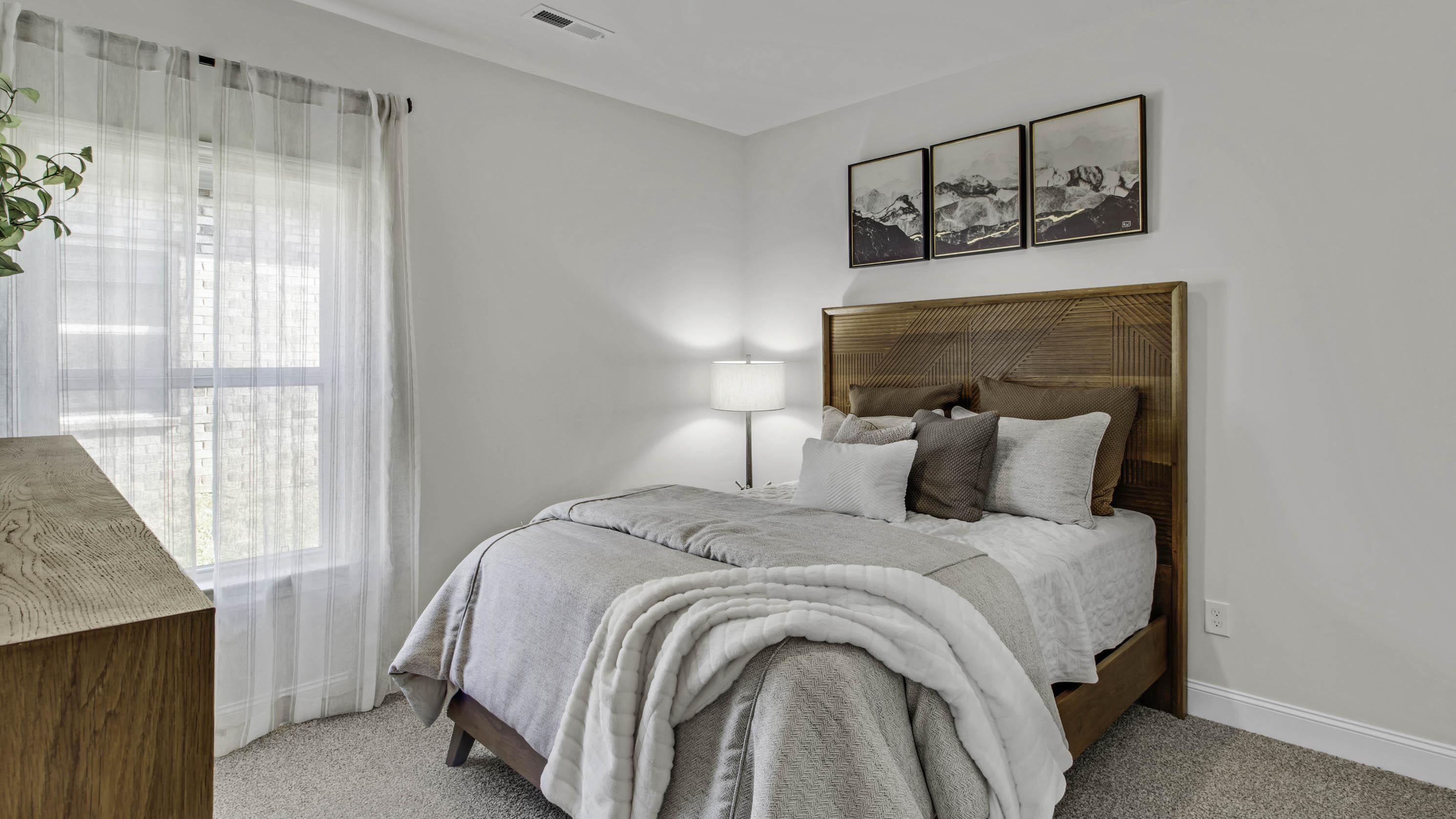 Fourth bedroom with neutral paint and carpet flooring
