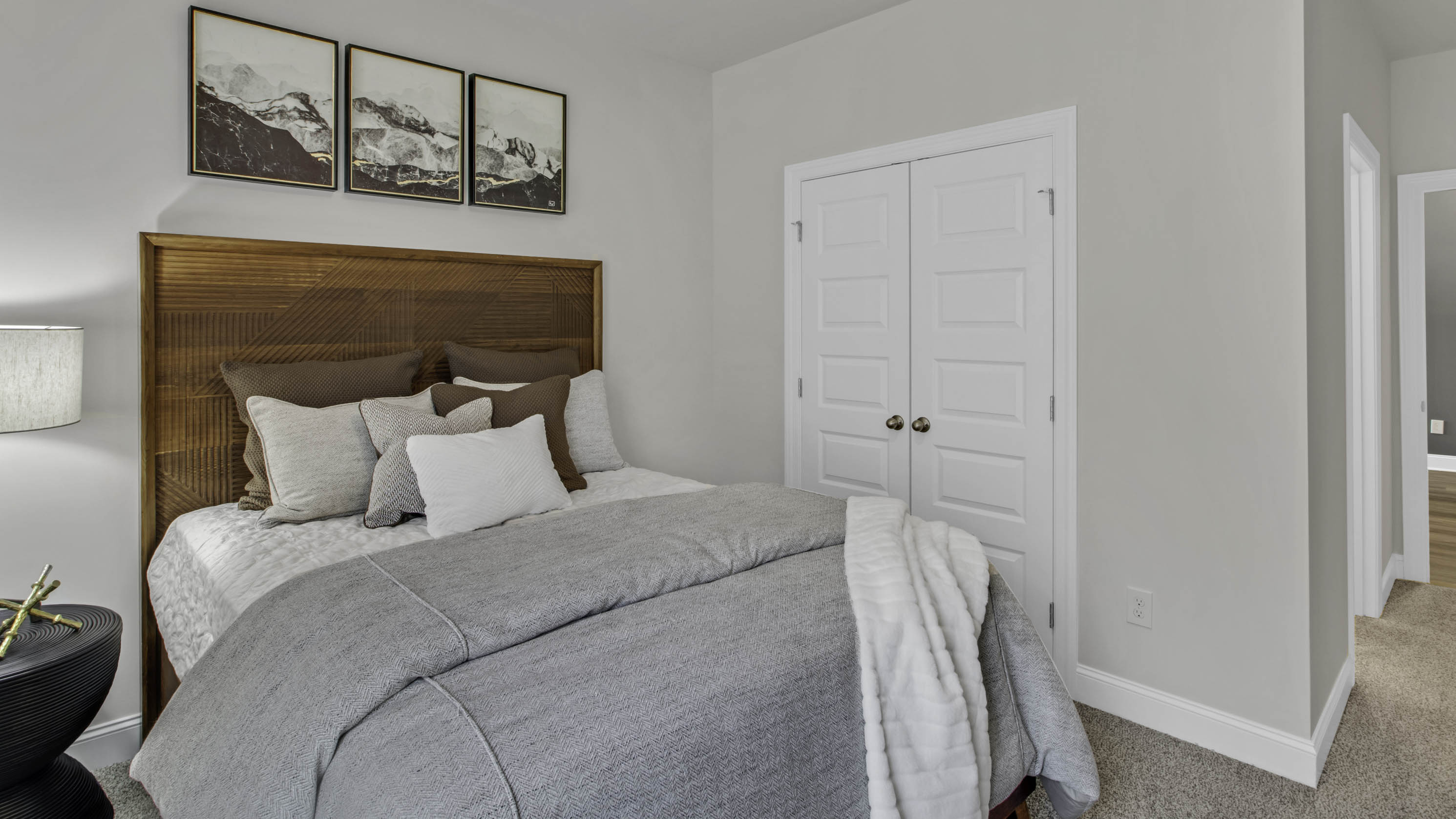 FOurth bedroom with a double door closet with ventilated shelving