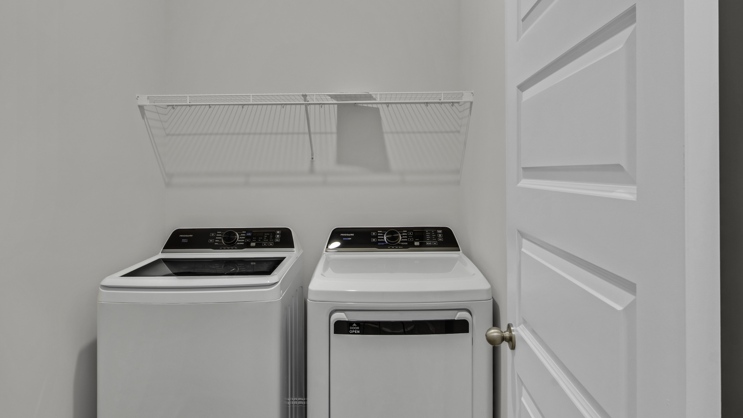 Laundry room with ventilated shelving