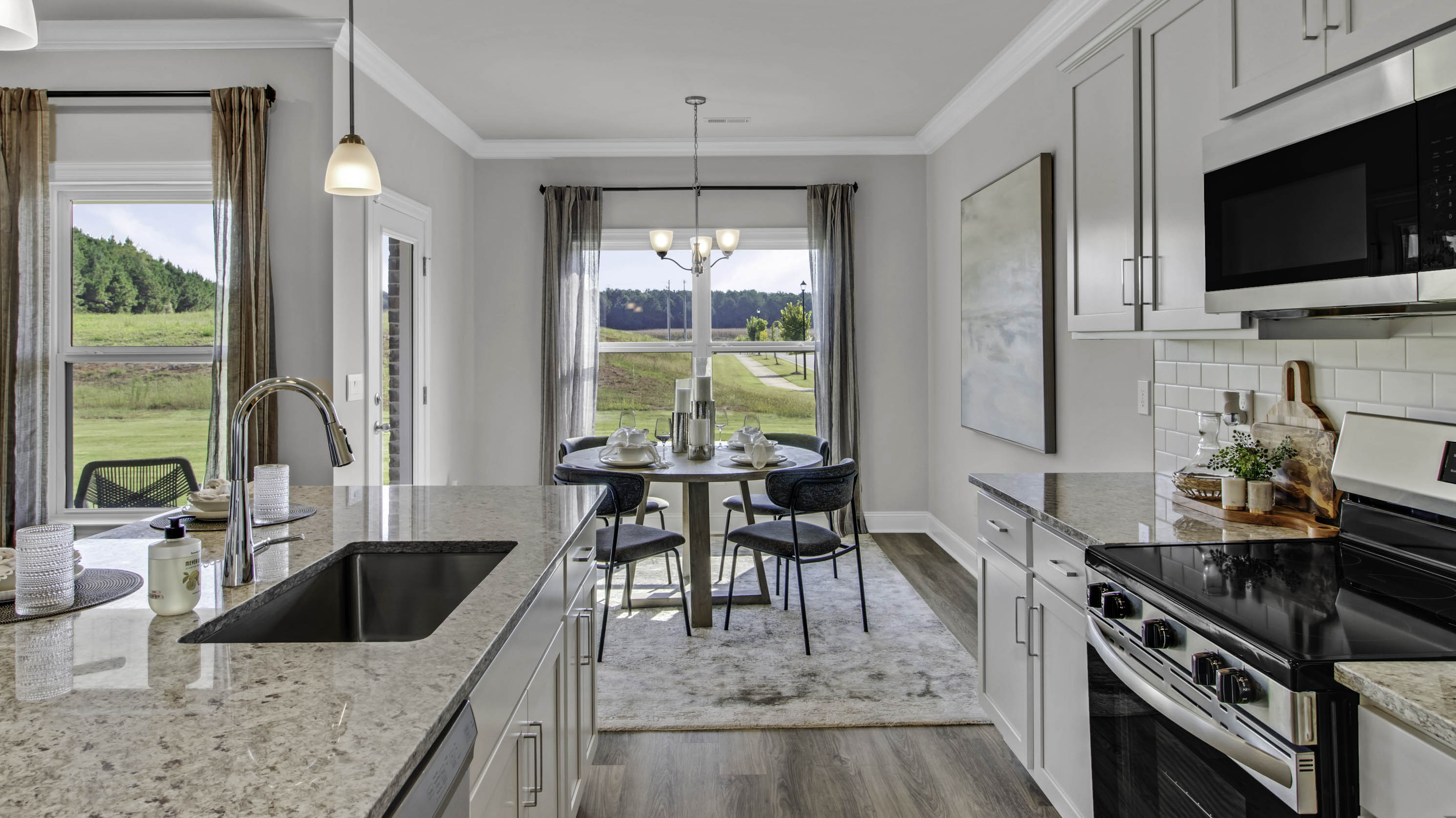 Beautiful quartz counter tops and stainless steel appliances in the kitchen