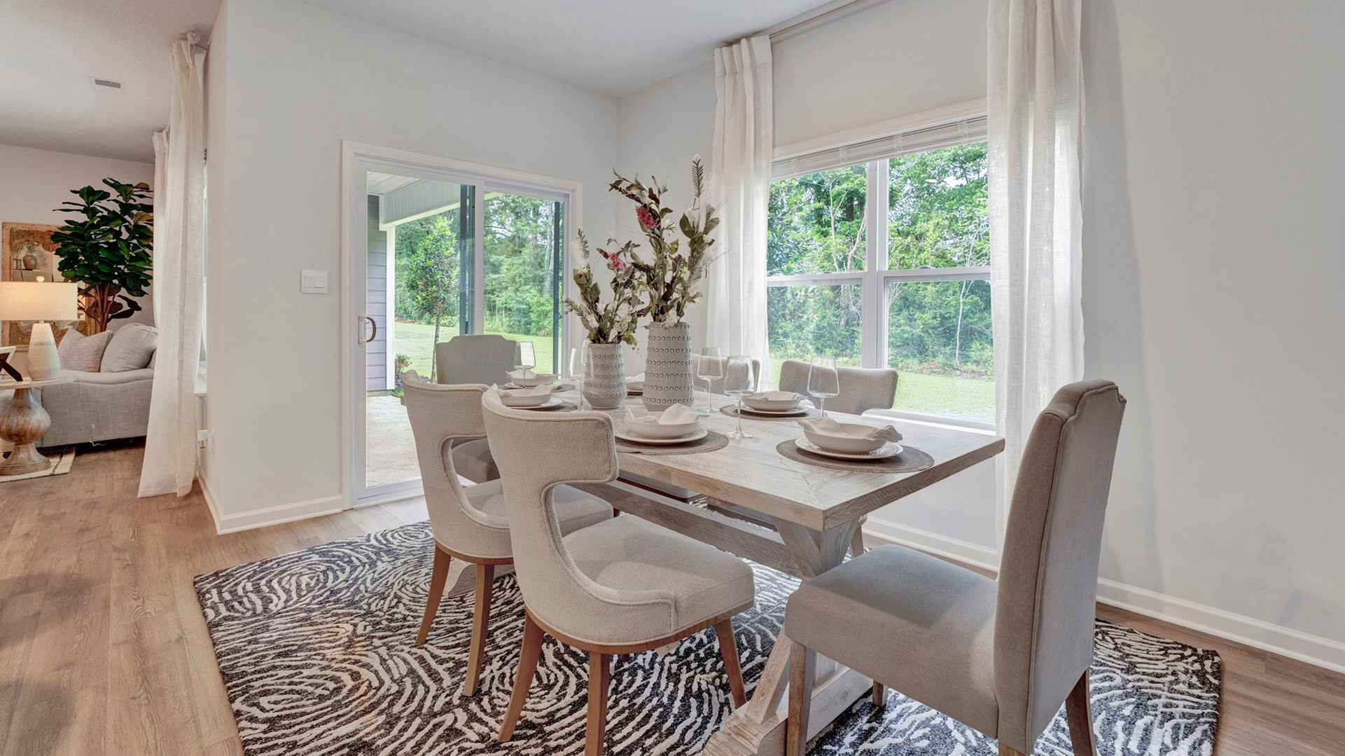Dining area with close access out to covered patio