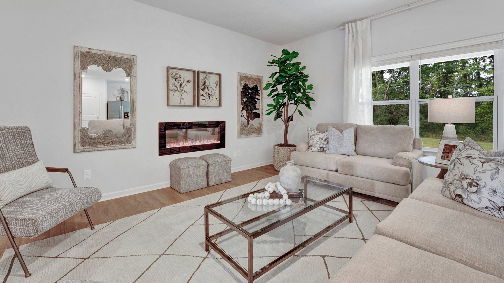 Spacious living room with vinyl flooring and neutral paint