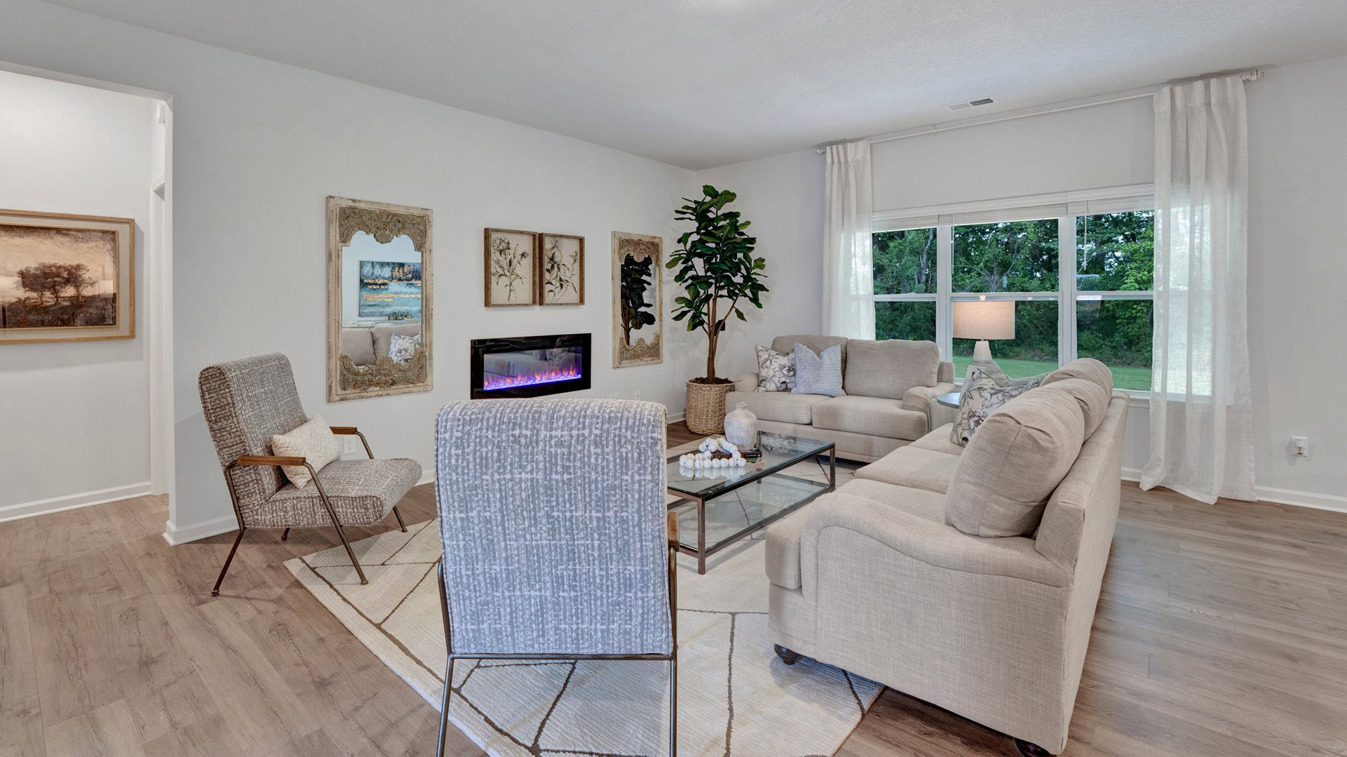 SPacious living room opens up at the end of entry hall