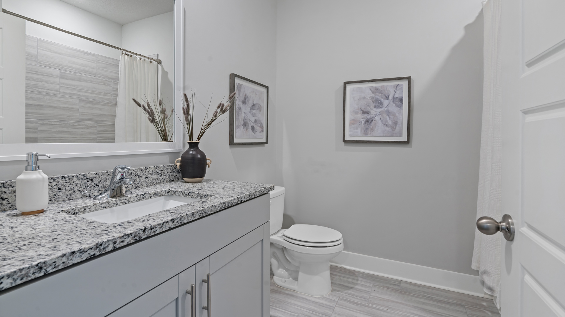 Third bathroom with a single vanity and an acrylic tub/shower insert