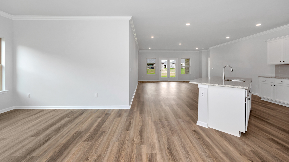 DIning room opens up at the end of entry hall