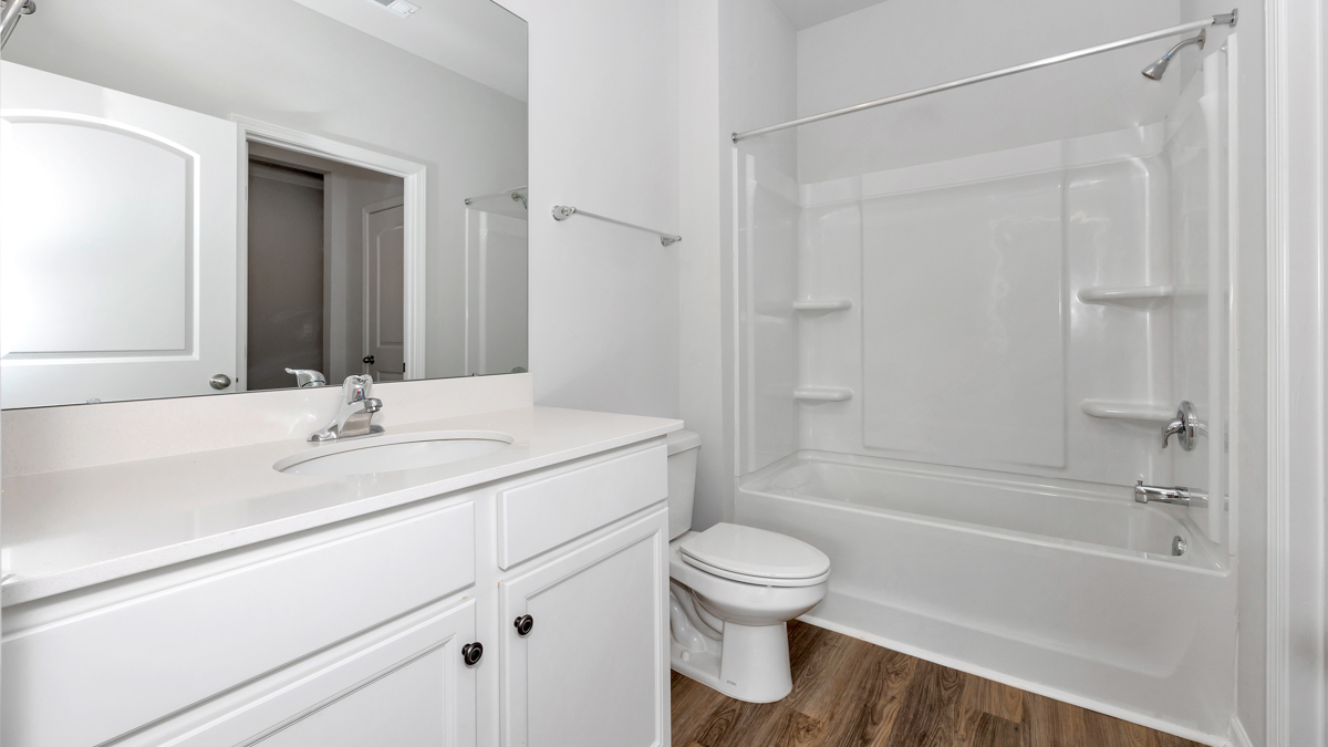 Guest bathroom with a single vanity and an acrylic tub/shower insert