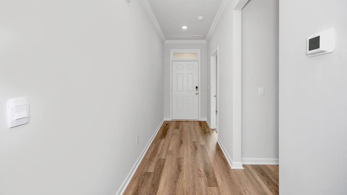 Front door entry of the kaithryn with vinyl flooring