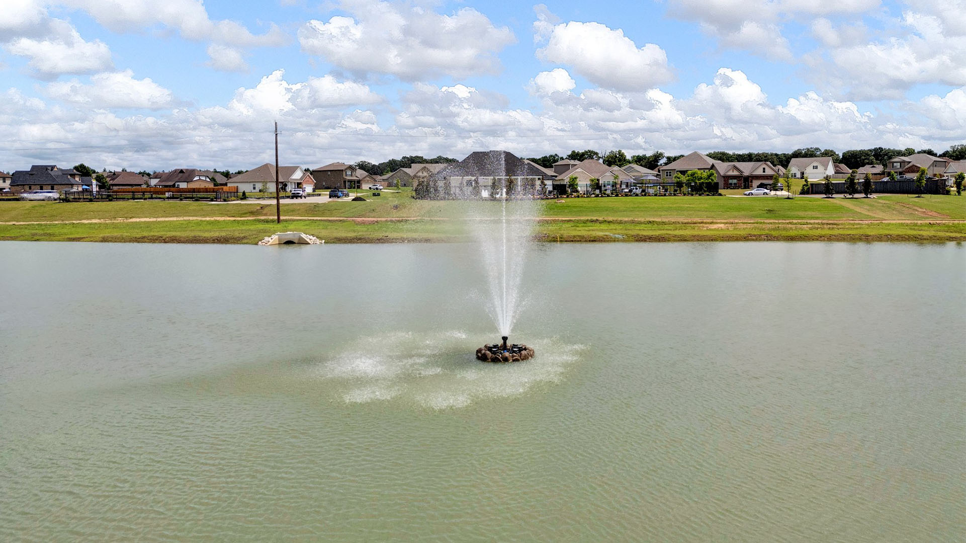 Beautiful community lake with a waterfall