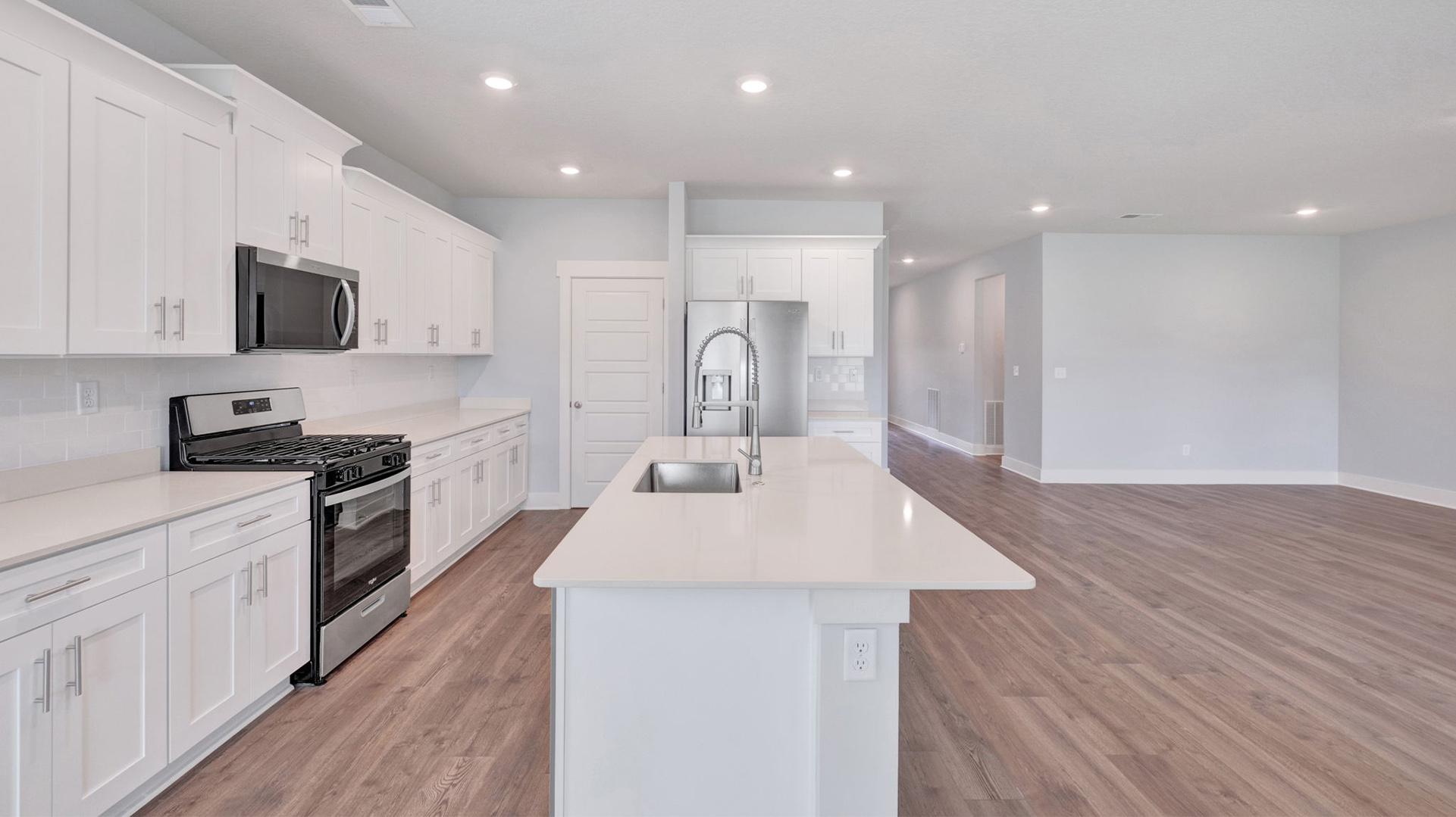 Spacious kitchen overlooks the living room area