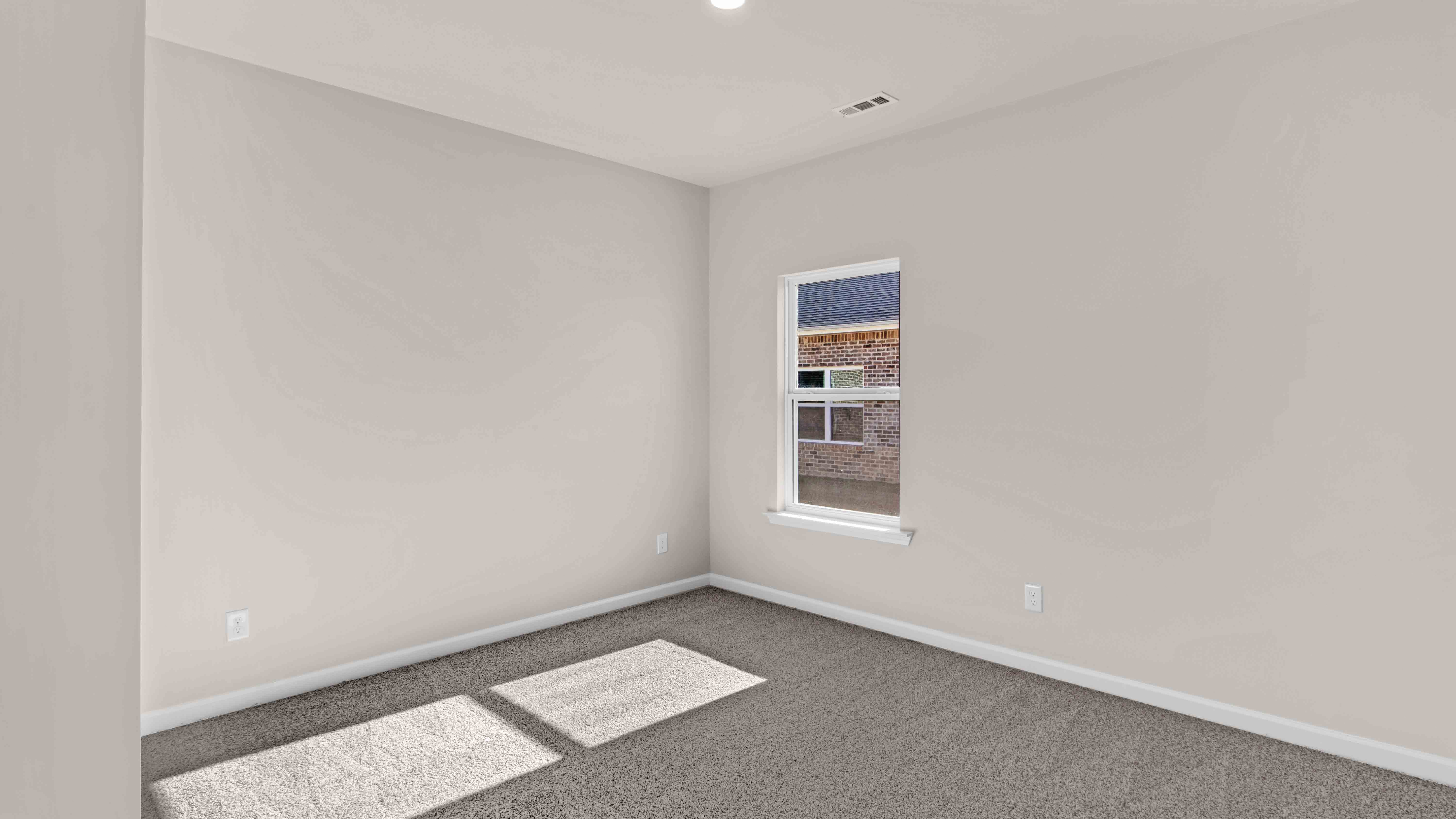 Third bedroom with a single window for natural light