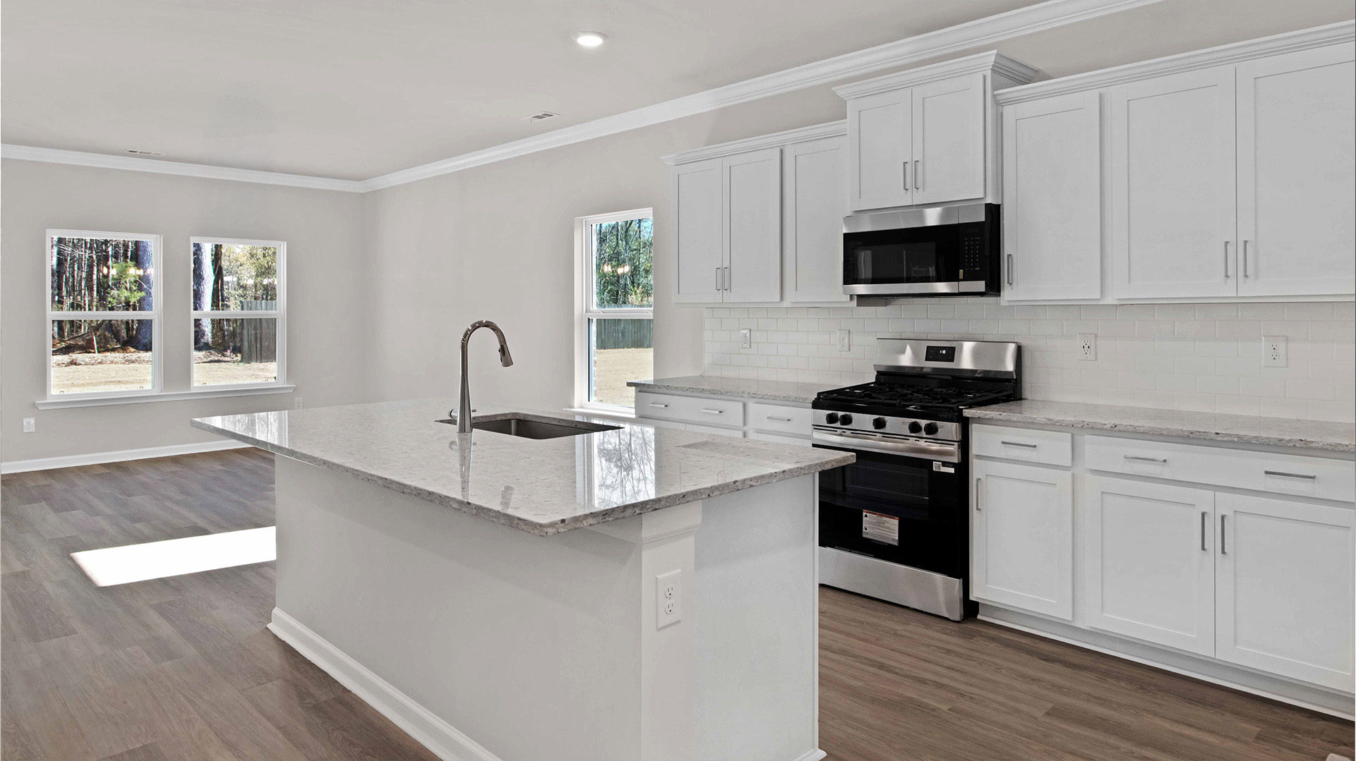 Kitchen with light cabinets and stainless steel appliances