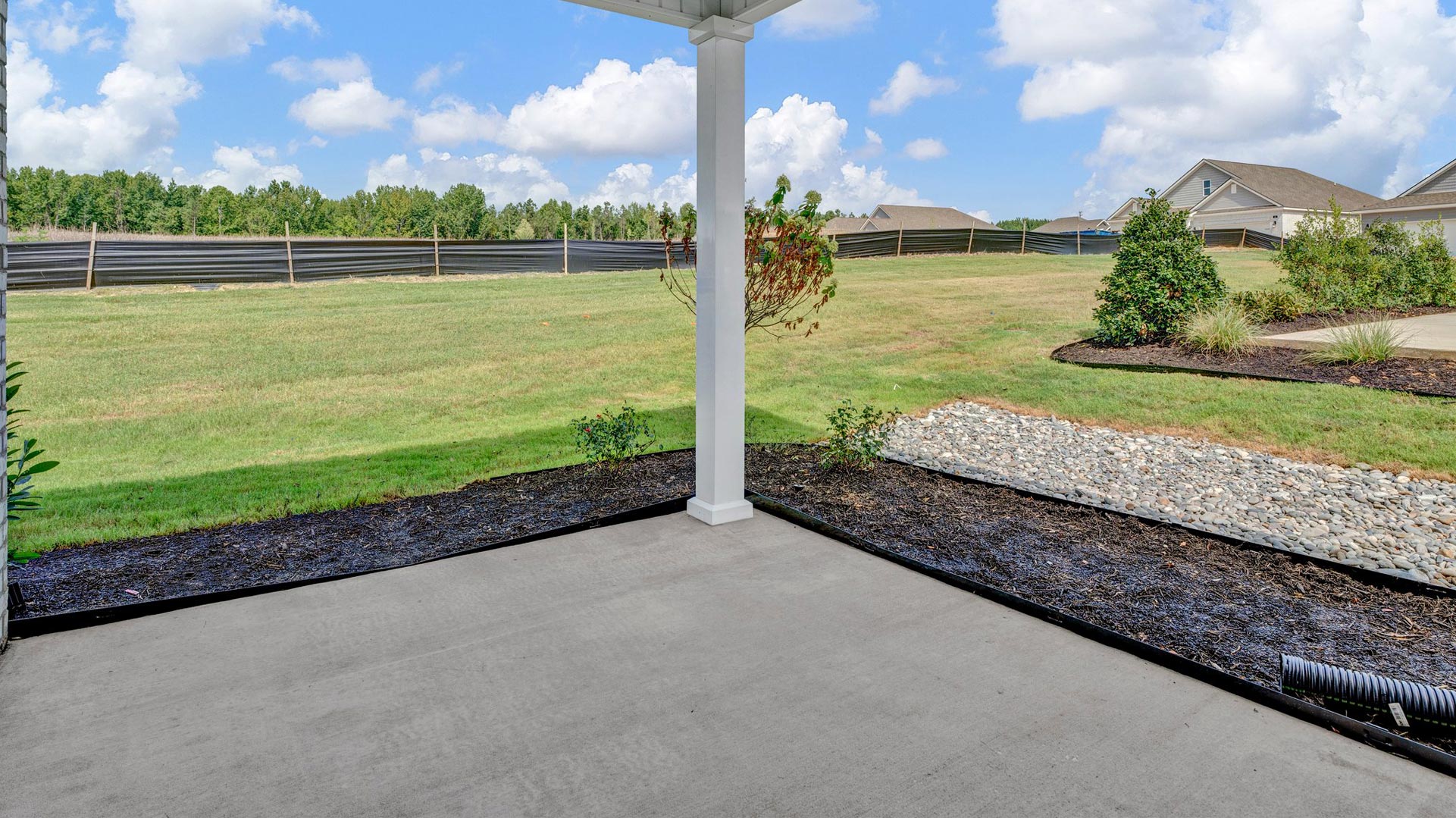 Covered patio overlooking the backyard