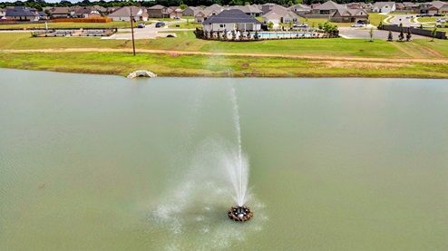 Riverwood Gardens community lake with waterfall