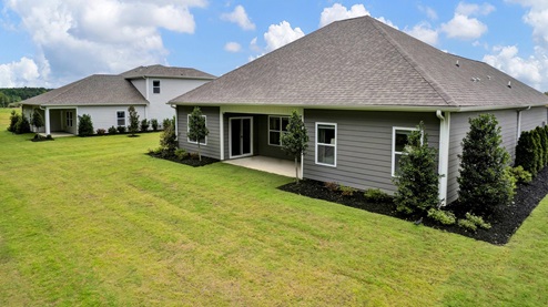 riverwood gardens new home community in oakland tennessee cairn plan covered patio overlooking the backyard