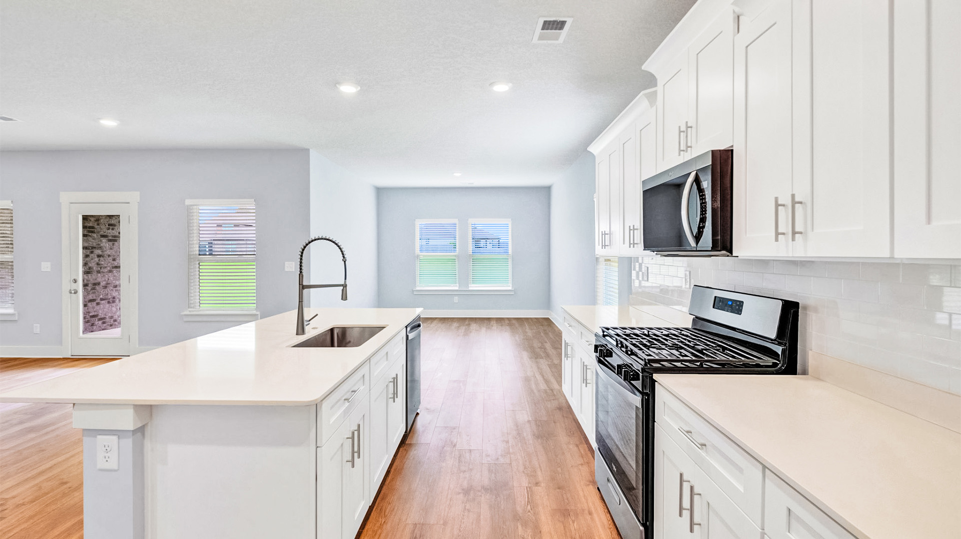 Beautiful kitchen flows seamlessly into the dining area