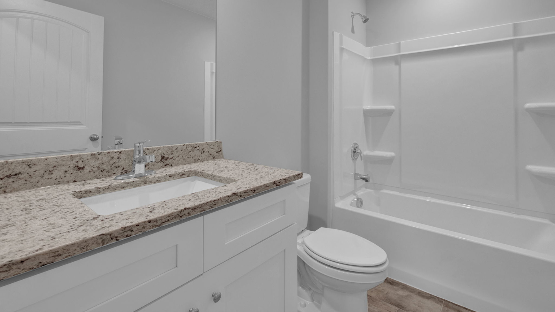 Second bathroom at the front of the home with a single vanity
