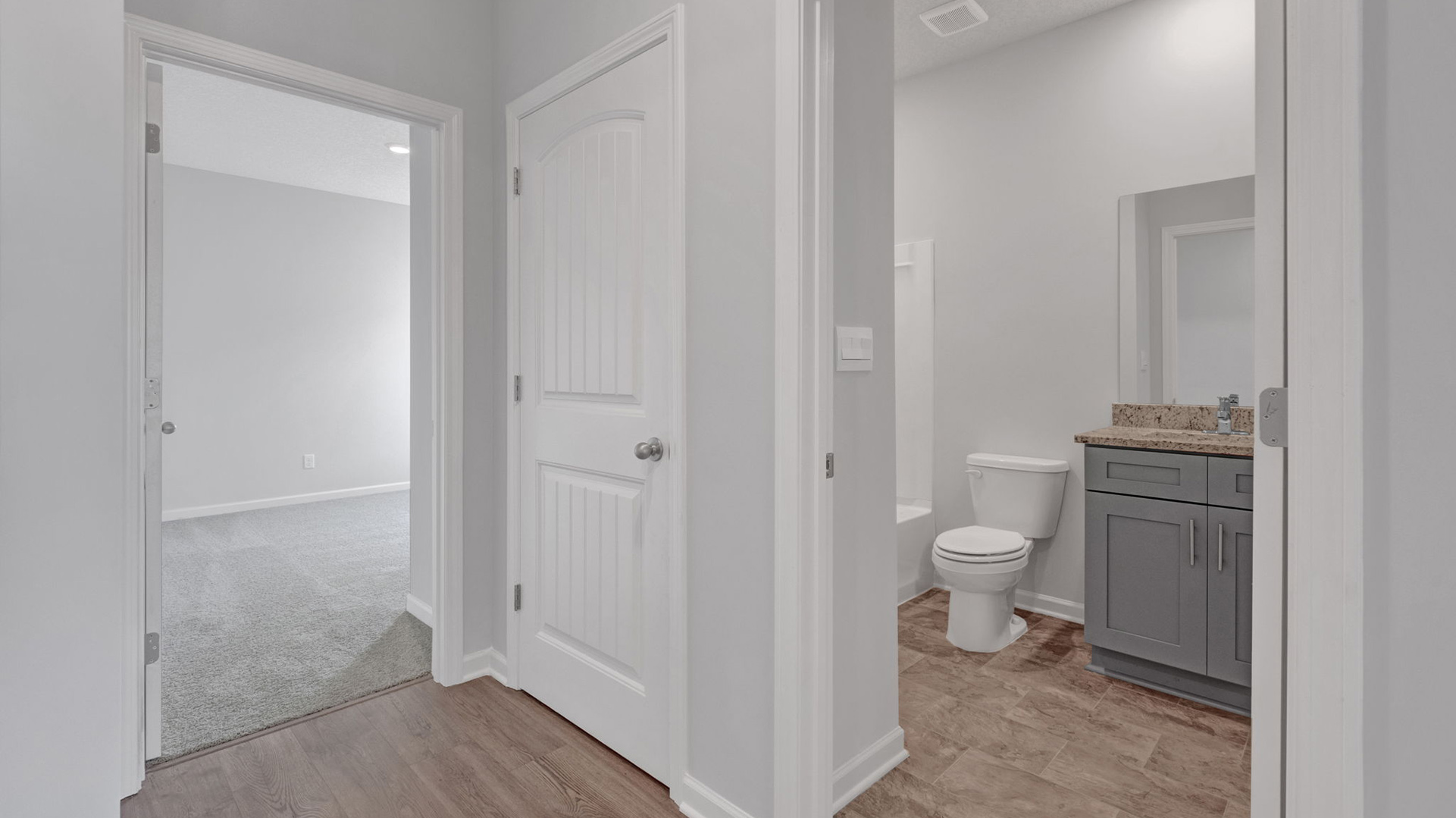 Entry foyer leading into the third bedroom