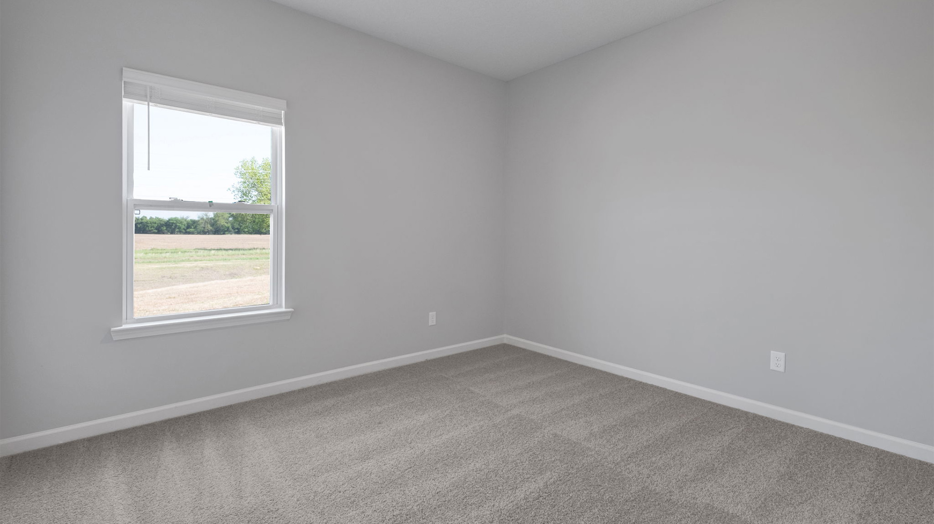 Fourth bedroom with carpet floors and neutral paint