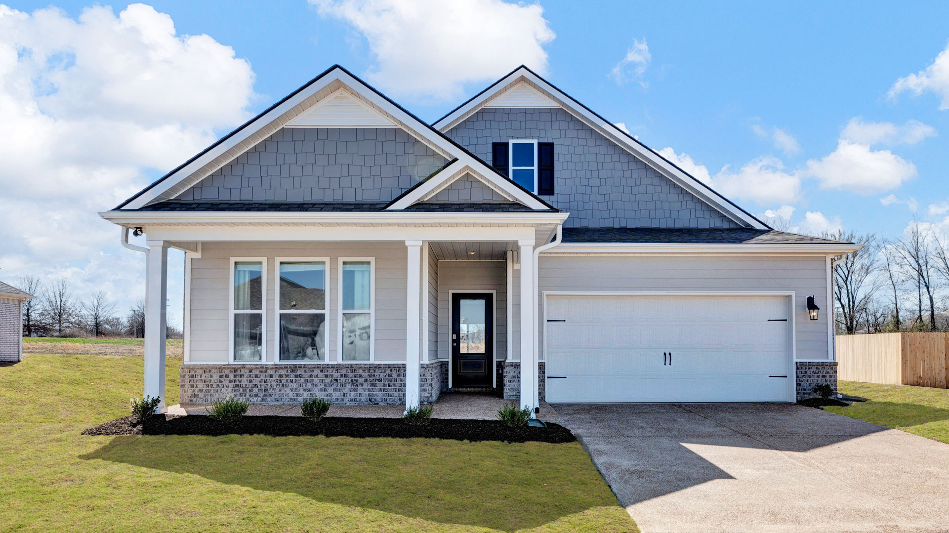 Exterior of a one-story brick home with a two-car garage