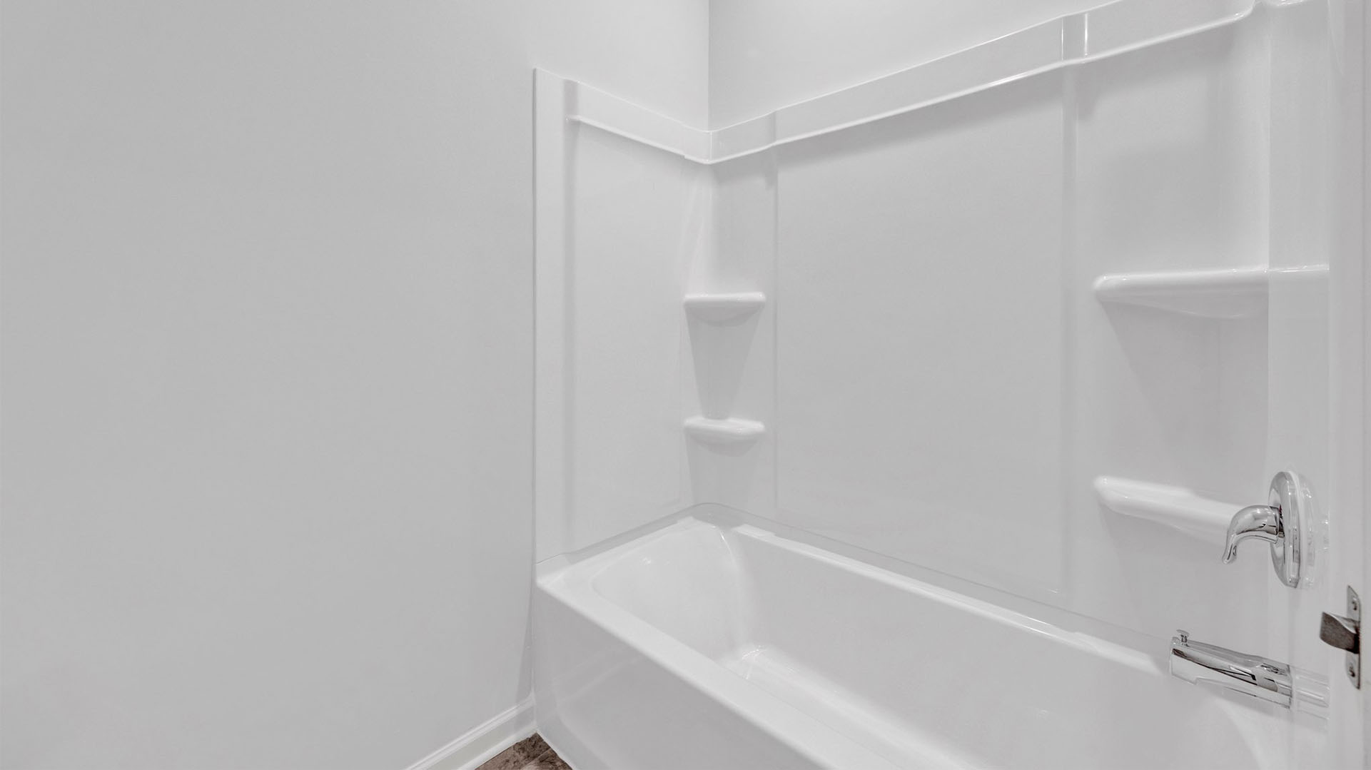 An acrylic tub/shower insert in second bathroom