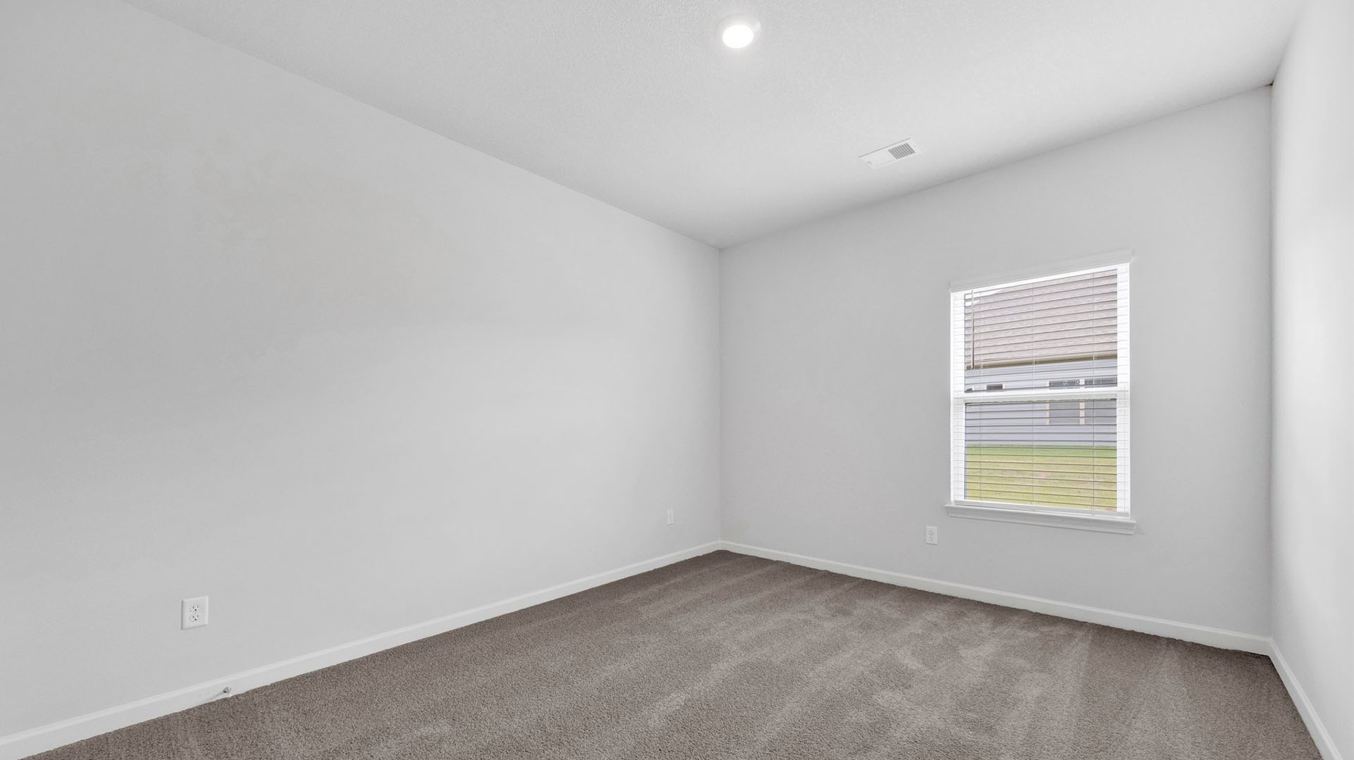 Fifth bedroom with recessed lighting and carpet flooring