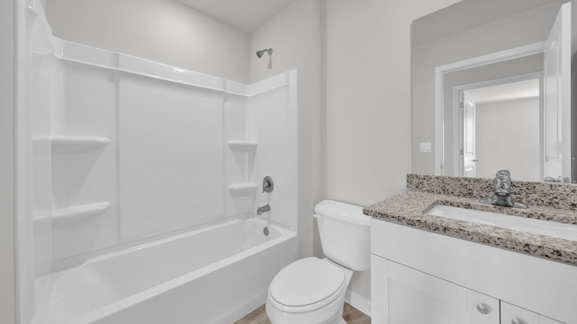 Third bathroom with an acrylic tub/shower insert