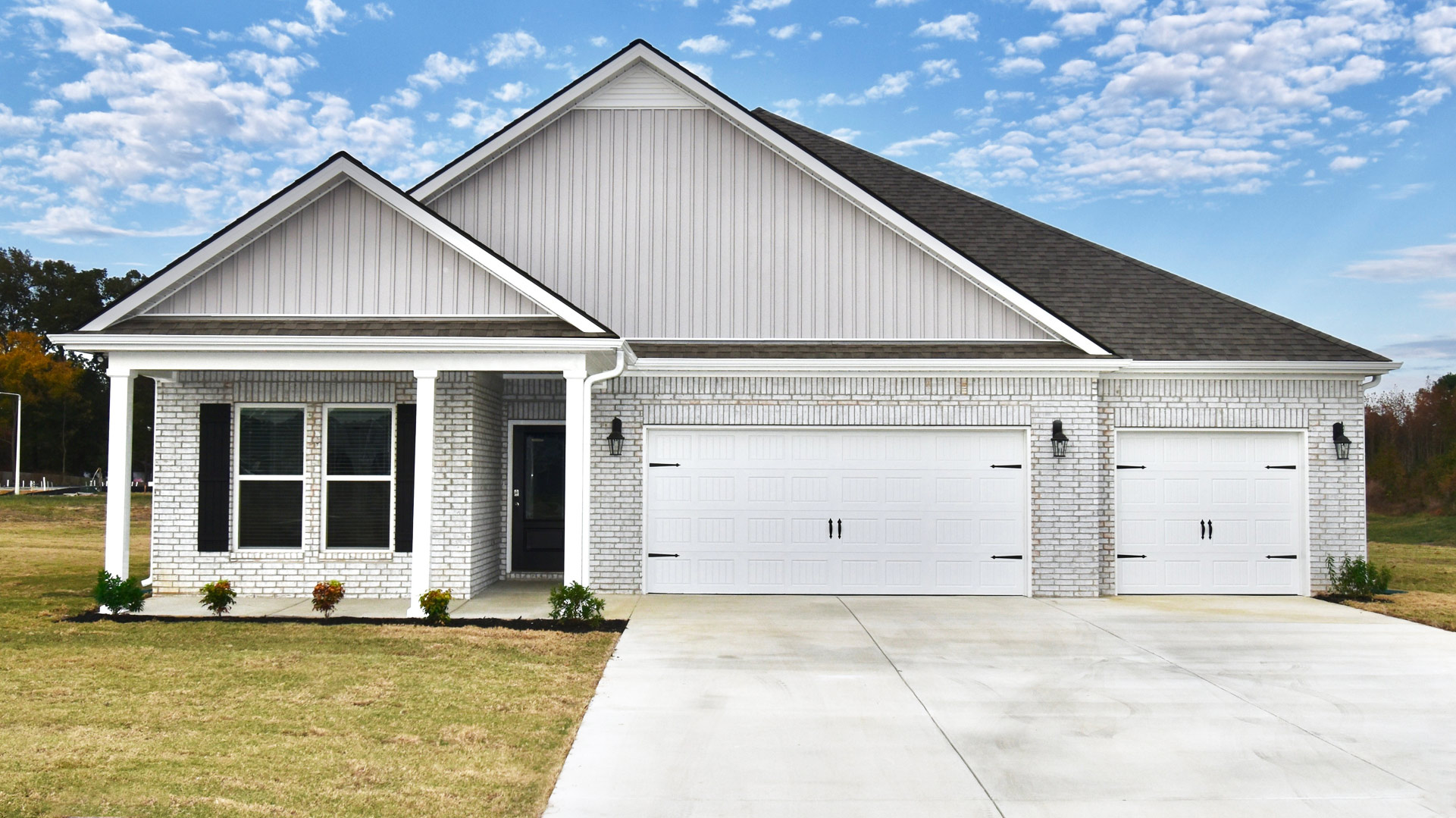 Exterior elevation of the Denham floorplan, a single story home with a three car garage