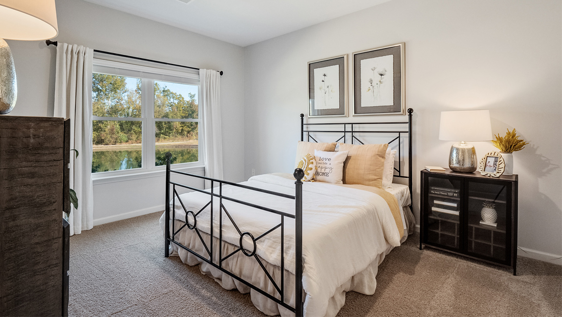 Primary bedroom with open wall space for décor and a comfortable layout at Villages at Southbranch