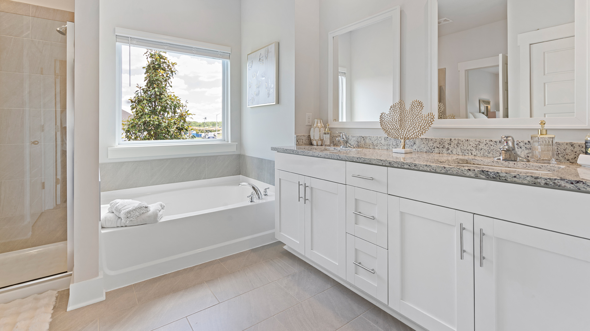 Primary en suite with a dual vanity and a tub