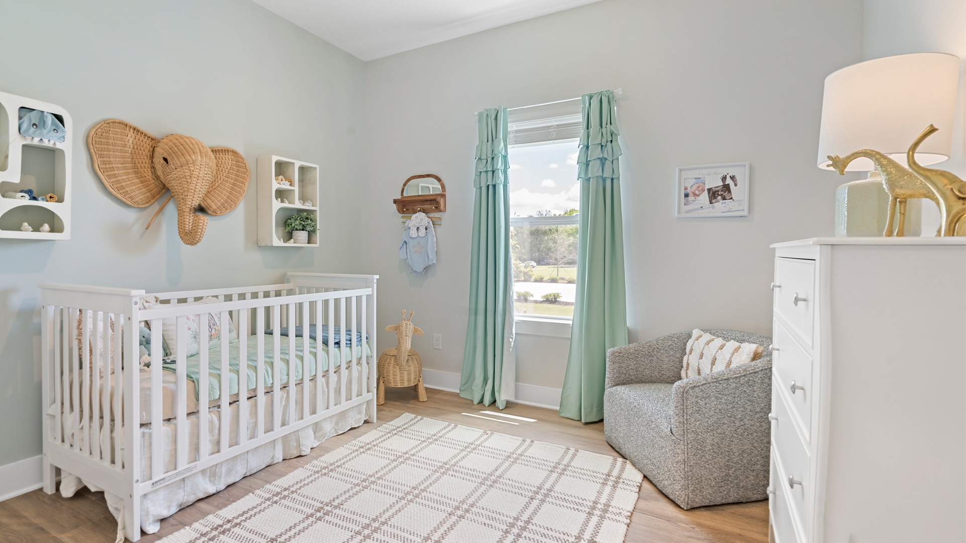 Second bedroom staged as a nursery