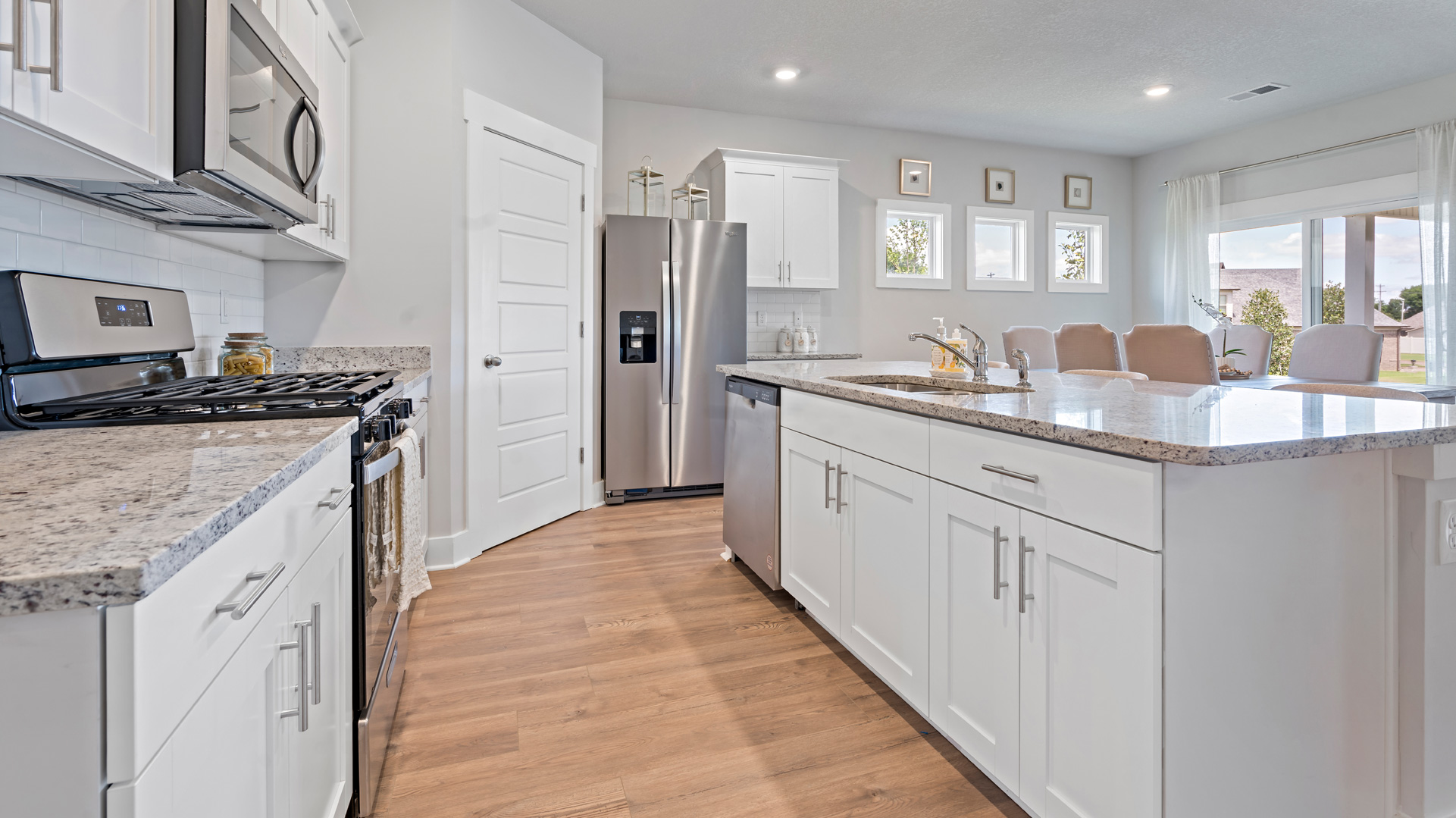 Beautiful kitchen with light cabinets and stainless steel appliances
