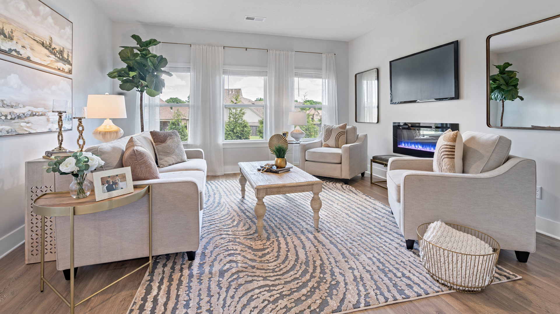 Beautiful living room with tall windows overlooking backyard