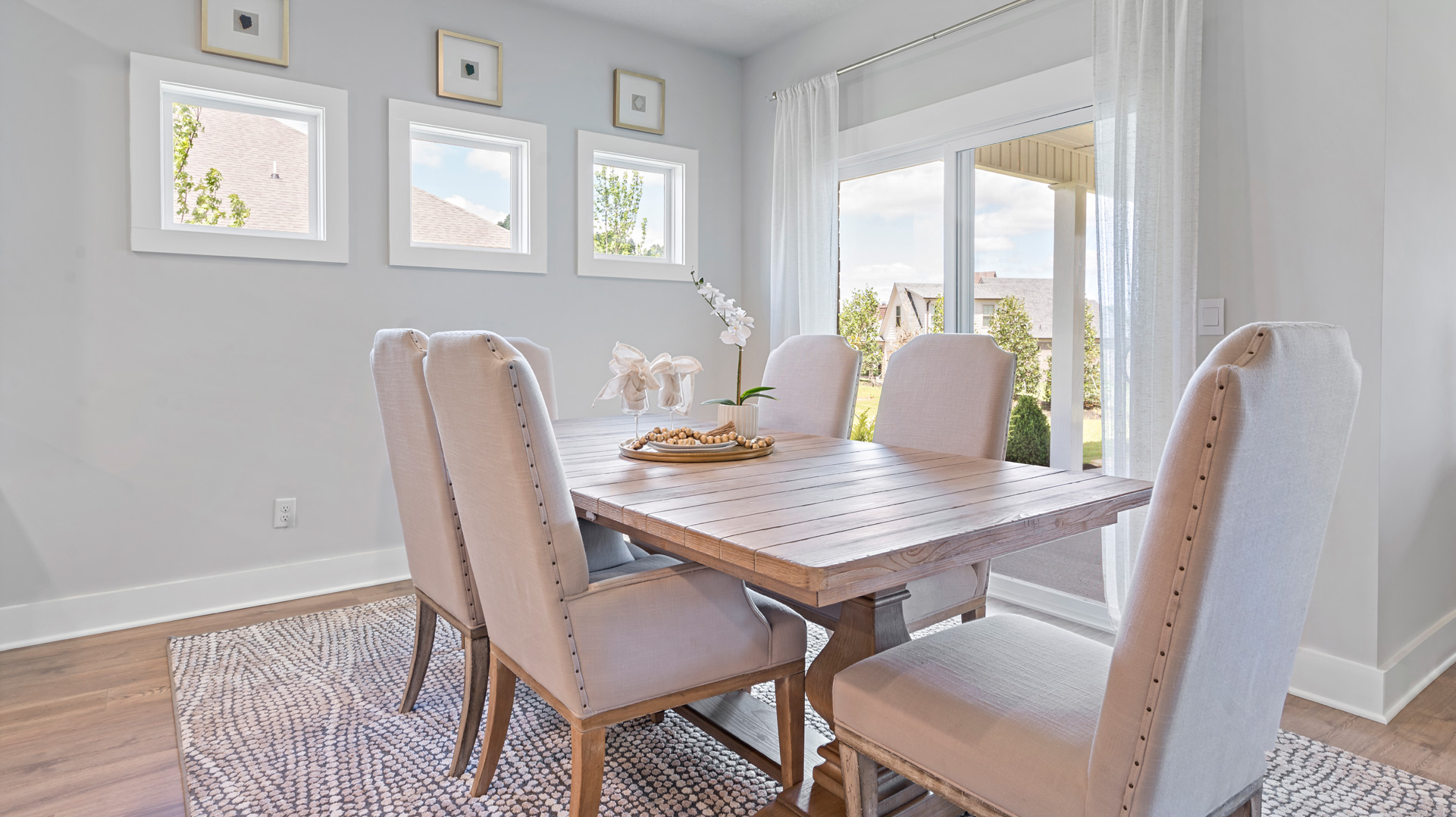 Dining room with picture window accents for natural light