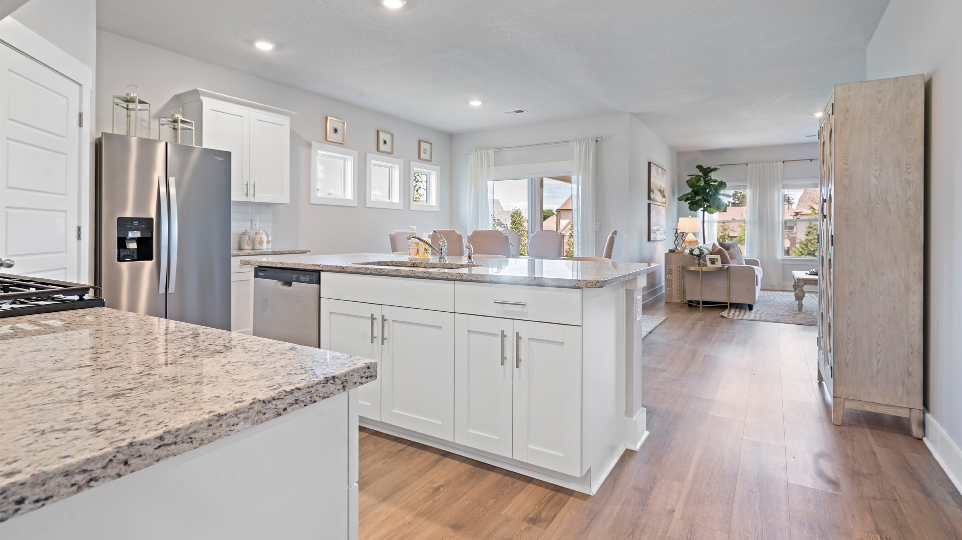 kitchen area opens up at the end of entry hall