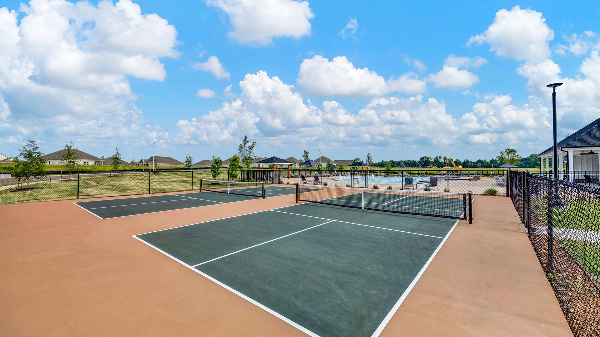 Pickleball courts attached to the pool for residents to enjoy