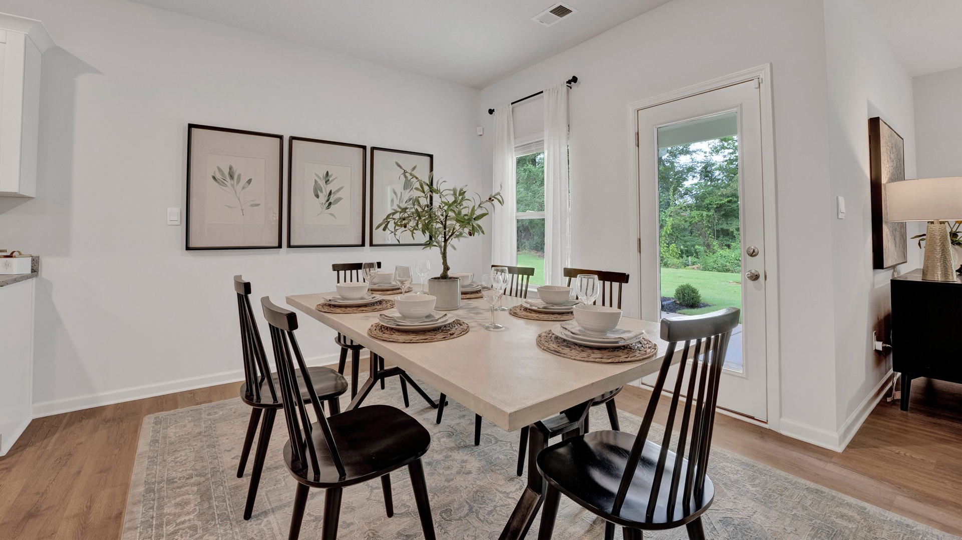 Dining room with close door access out to covered patio
