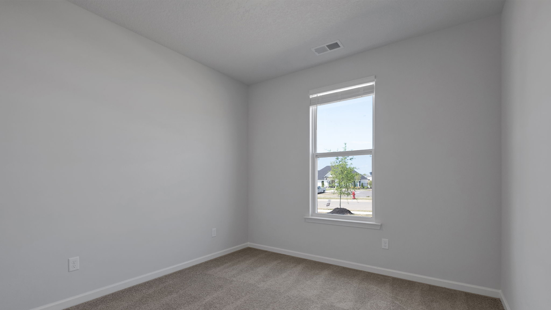 Third bedroom with carpet flooring