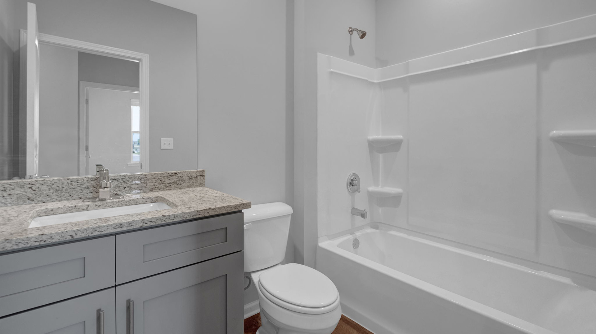 Second bathroom with a granite top vanity