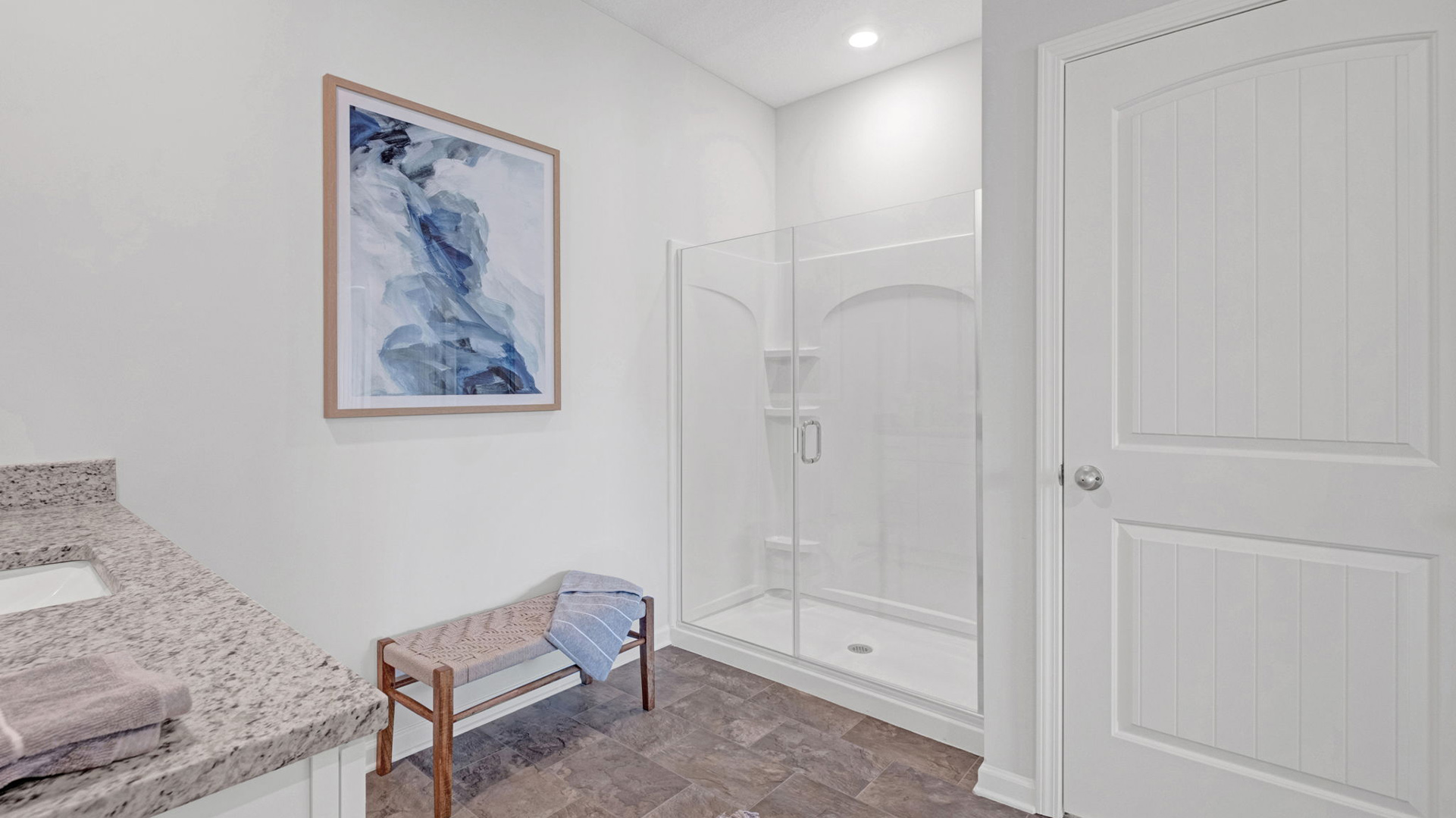 En suite with a glass enclosed walk in shower