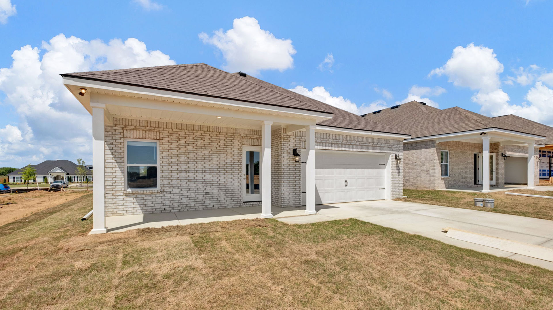 Exterior of the back of the home with a covered patio