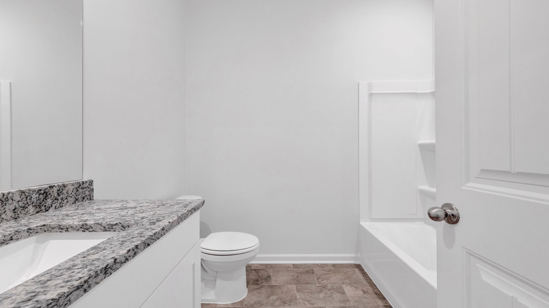 Second bathroom with granite countertop vanity
